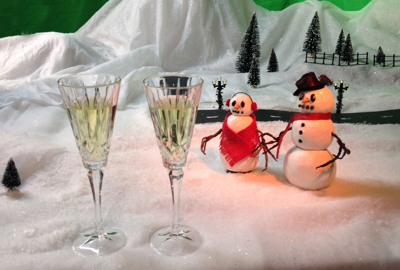 Close up of puppets with champagne glasses at the end of the production
